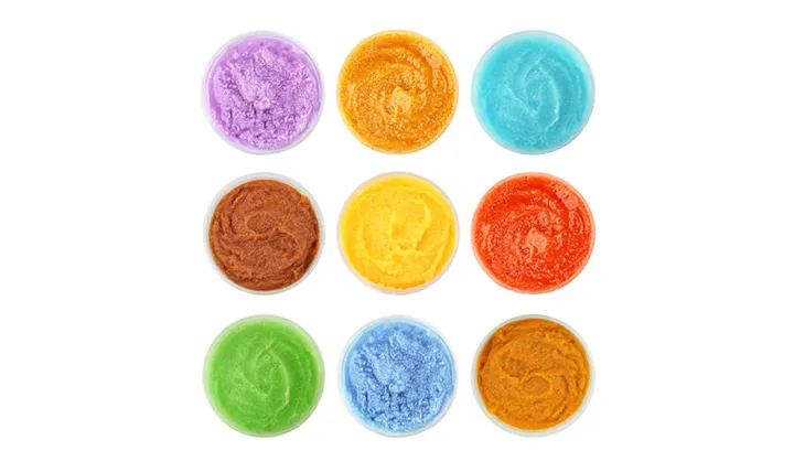 Nine pots of colorful body scrub